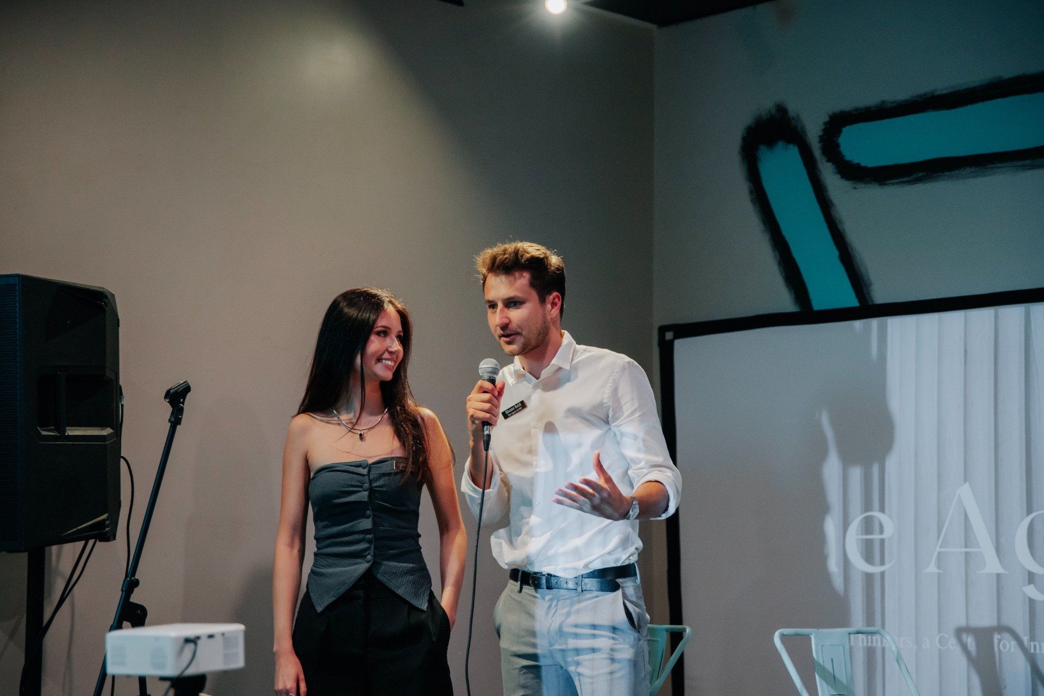 Agora leaders presenting ideas at a public forum